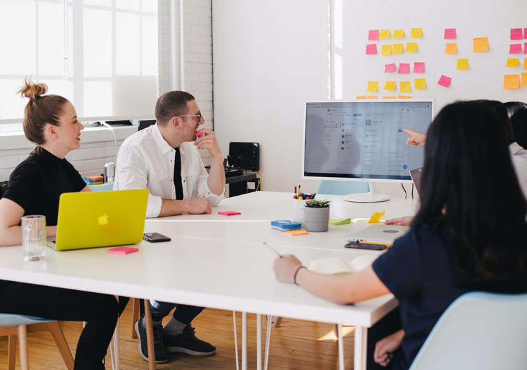 Professional team in strategic workshop with digital solutions